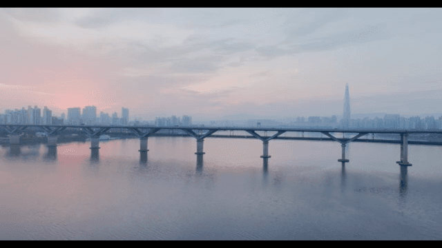 City skyline with a bridge at sunset