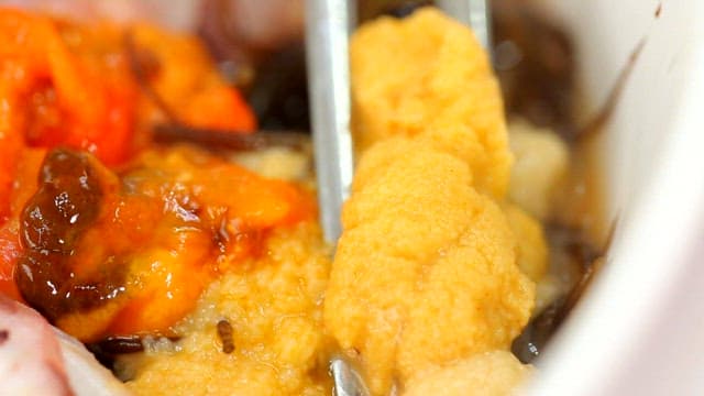 Fresh cold raw fish soup with sea urchin roe