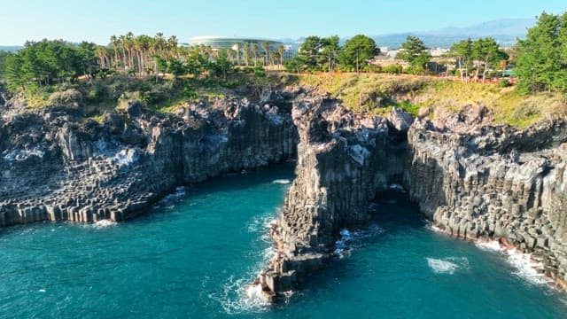 Coastal cliffs and blue ocean waves