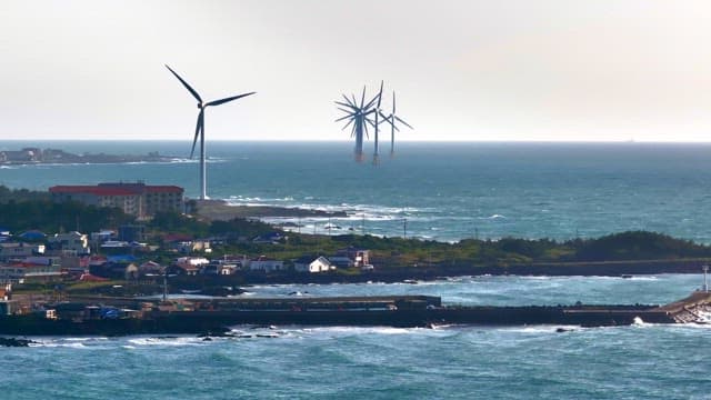Coastal town with wind turbines
