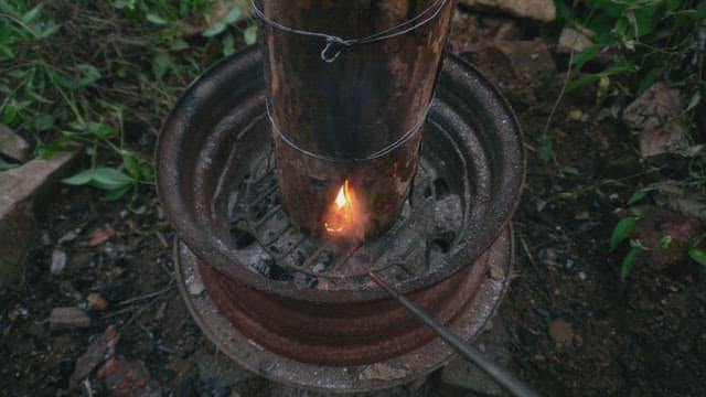Firewood burning in a metal barrel