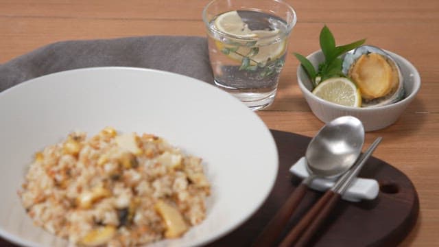 Neat meal of abalone fried rice set out on a cozy table