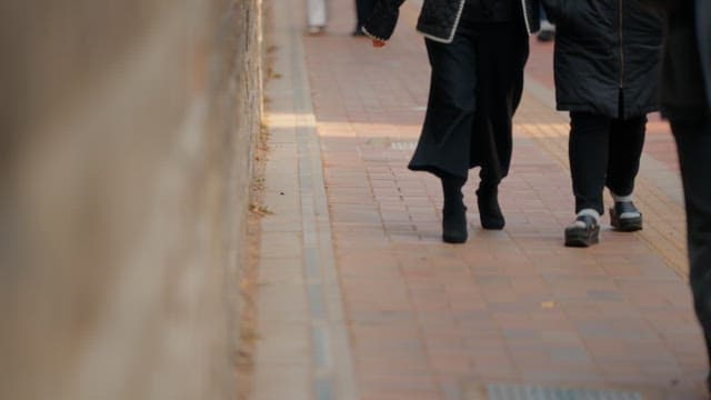 People walking on a sidewalk
