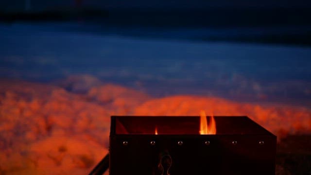 Bonfire from a portable stove that lights up the night