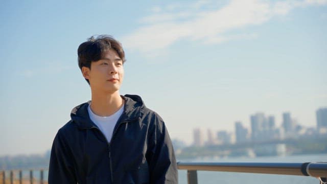 Man drinking water while walking