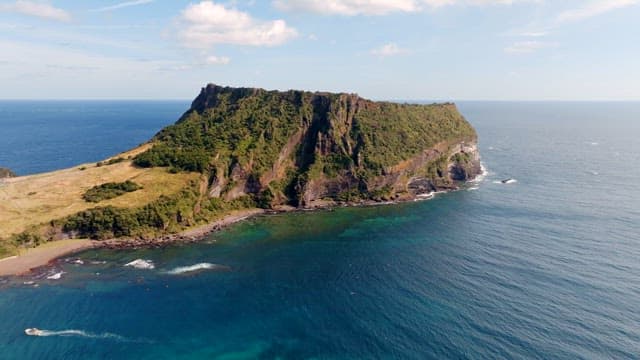 Scenic island with lush greenery and ocean