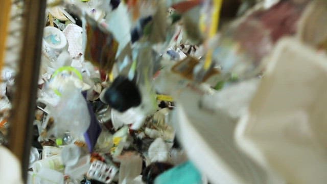 Lots of Plastic Waste Falling into the Garbage Dump