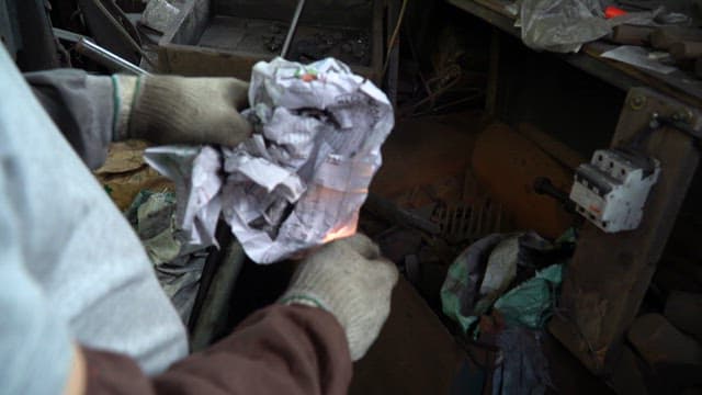 Lighting paper in a workshop