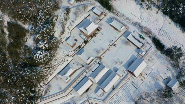 View of a traditional hanok village covered in snow