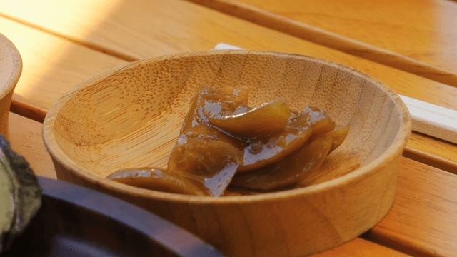 Sour pickled vegetables in a wooden bowl