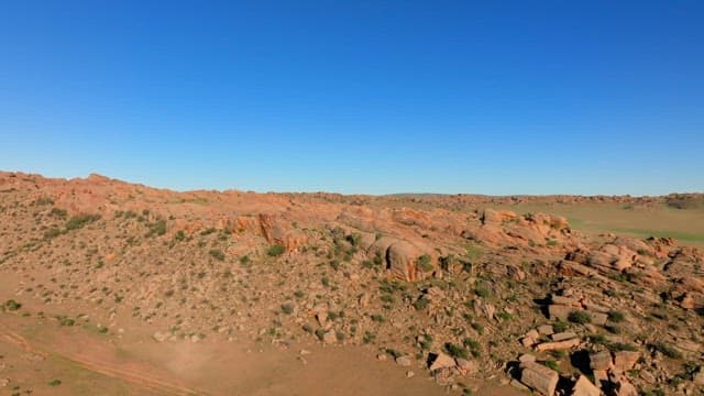 Rocky landscape under a clear blue sky