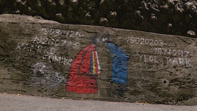 Mural of Korean traditional wedding painted on a cement wall on the street