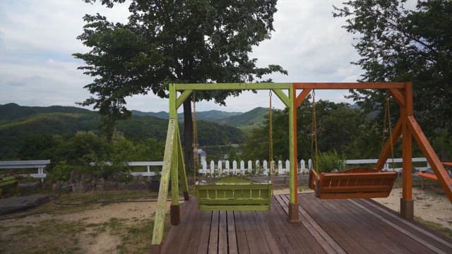 Swing in the Garden Overlooking the Green Mountains