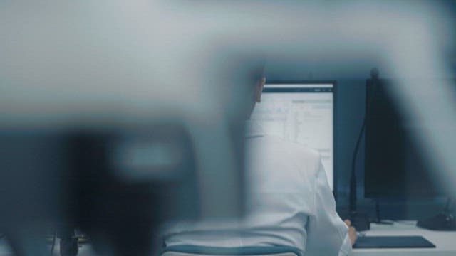 Professional Working on Computer in Office