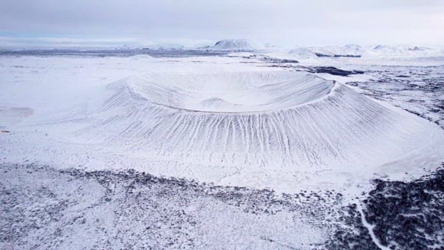 Snow-covered volcanic crater in winter