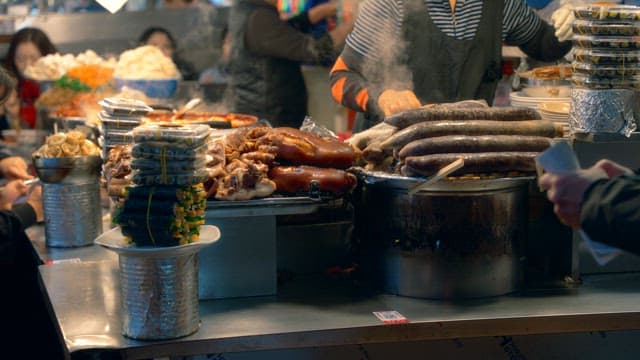 Food vendors at a busy Gwangjang market in Korea