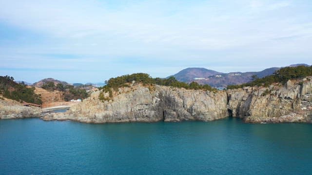 Tranquil Coastal Landscape with Rocky Cliffs