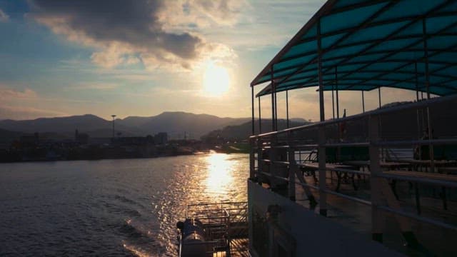 Boat Crossing the Water at Sunset