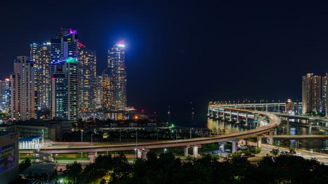 Night View Illuminated by the Lights of Buildings and Traffic in a Bustling City