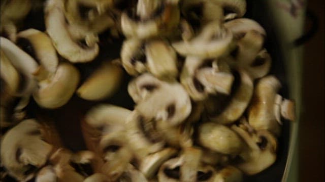 Button mushrooms grilled in a pan
