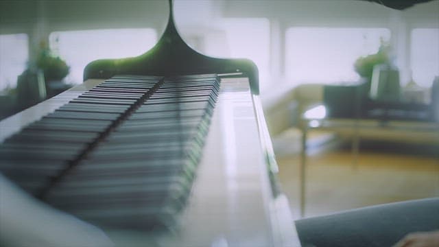 Hands wiping piano keys