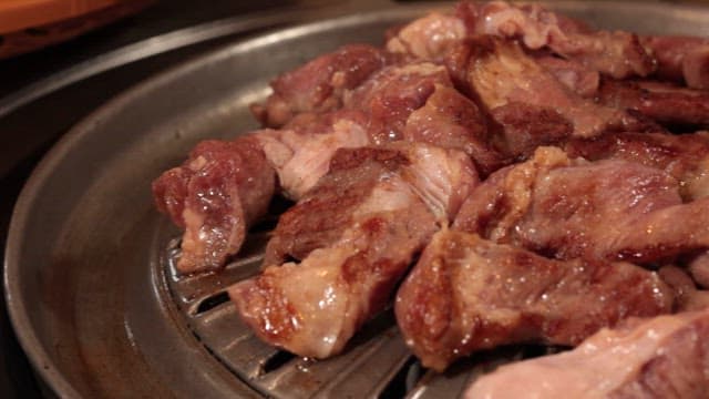 Wrapping Barbeque on a Grill with Vegetables