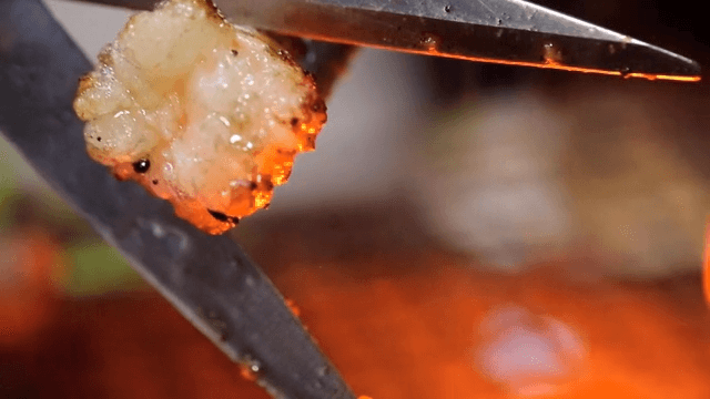 Grilled beef large intestines cut with scissors