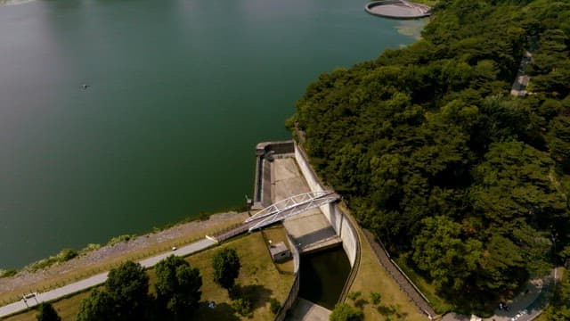 Aerial view of a city with high-rise buildings and a lake