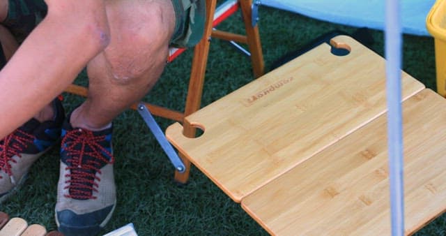 Setting up a picnic table with food