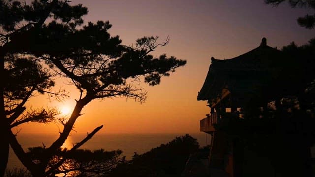 Wooden Pavilion by the Sea at Peaceful Sunset
