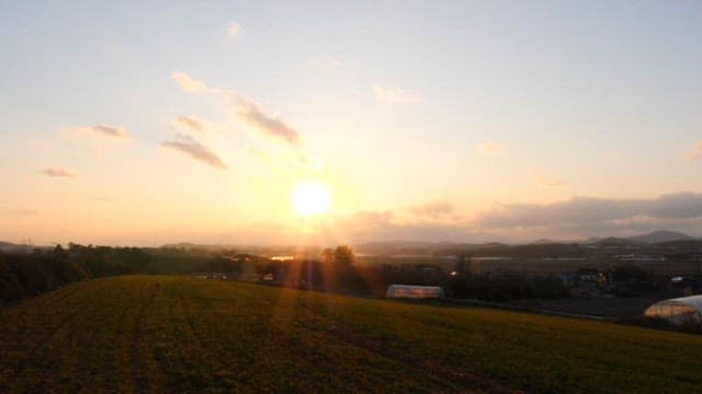 Sunset over a rural landscape with fields