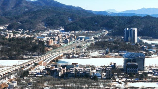 Snow-covered town with a railway