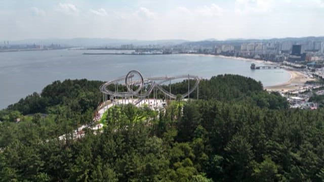 Coastal City with Roller Coaster Shaped Artwork of Stairs
