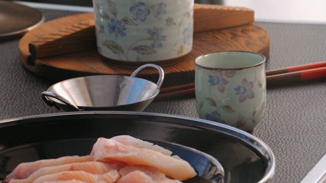 Fresh Raw Fish with Cup of Warm Tea