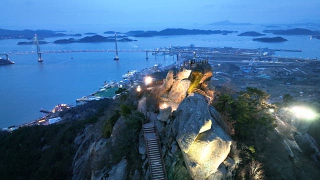 Scenic view of a bridge and coastline at dusk
