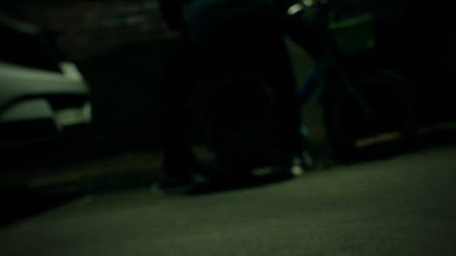 Person Running away with a Bicycle on a Dark Night Street