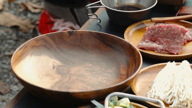 Preparing Meat for with Wooden Cooking Utensils