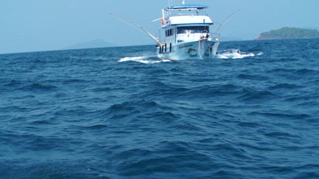 Ship sailing on a sea with rough waves