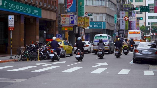 Busy street with cars and motorcycles