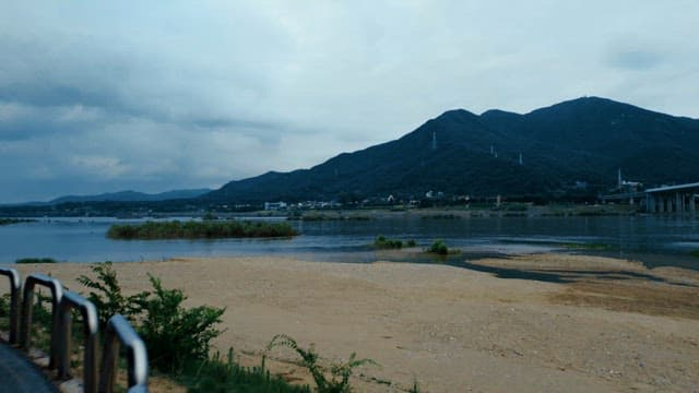 Serene river with mountains in the background