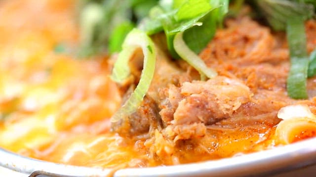 Napa cabbage and pork backbone stew with fresh vegetables