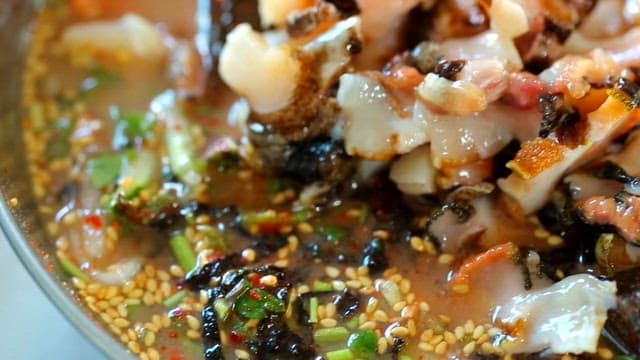 Close-up of fresh top shell cold raw fish soup