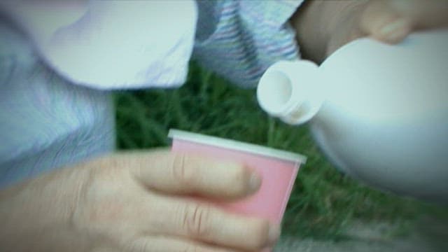 Pouring Makgeolli into a Cup Outdoors