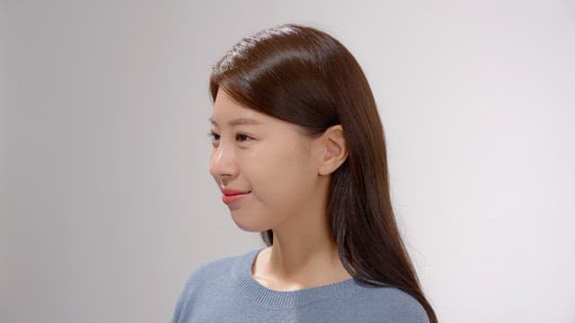 Long haired woman smiling happily