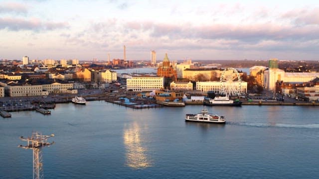 Sunset port city harbor with cruise ships passing by