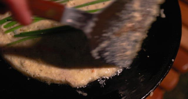 Preparing Savory Korean pancake on a Hot Skillet
