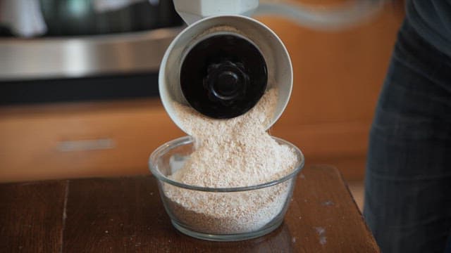 Powder made by grinding wheat bran in a grinder on the kitchen table