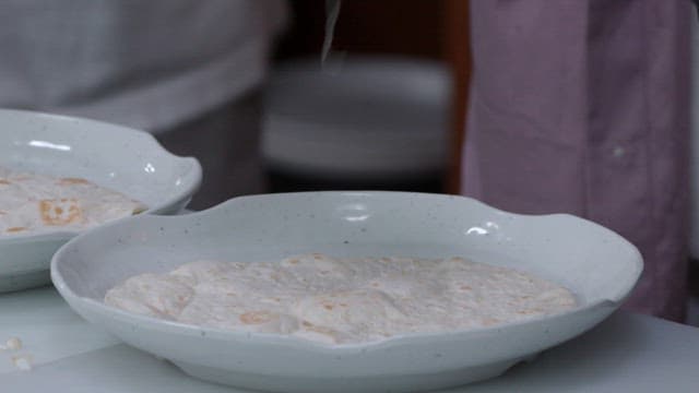 Cheese and Corn Filling being Placed on Tortillas