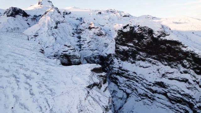 Snow-covered mountains with a deep gorge