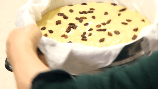 Steamer with raisin-topped chestnut bread dough